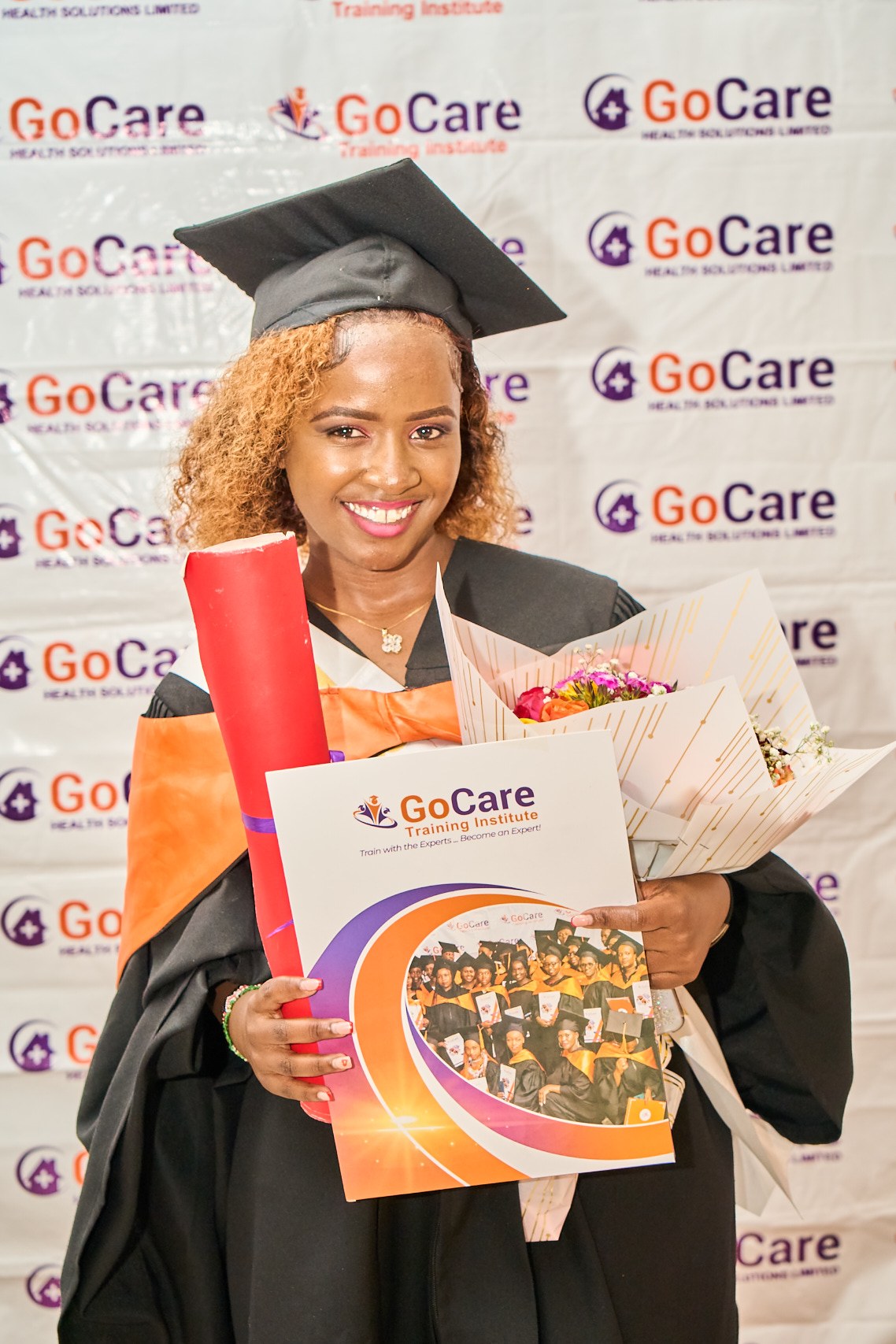 GoCare graduate holding her certificate